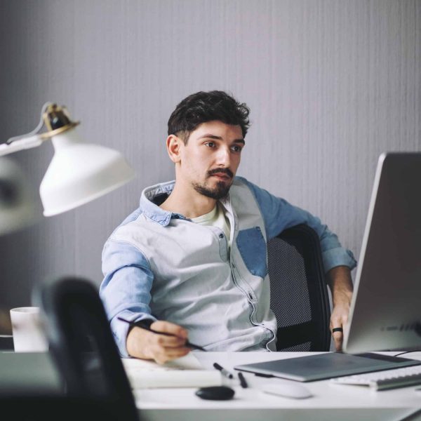 handsome-businessman-working-in-office.jpg handsome-businessman-working-in-office.jpg